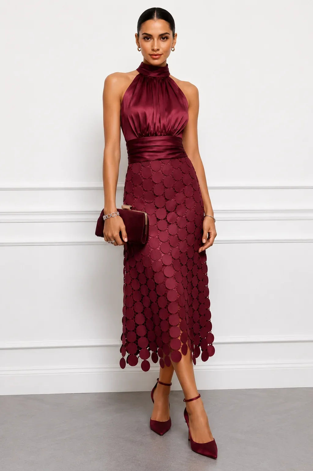 Burgundy halter dress with ruched waist and loose discs at the hem
