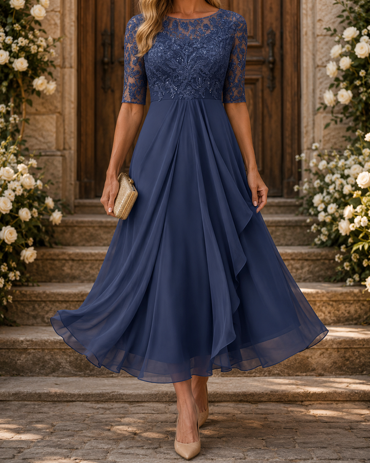 Blue lace dress worn on stone steps decorated with white roses