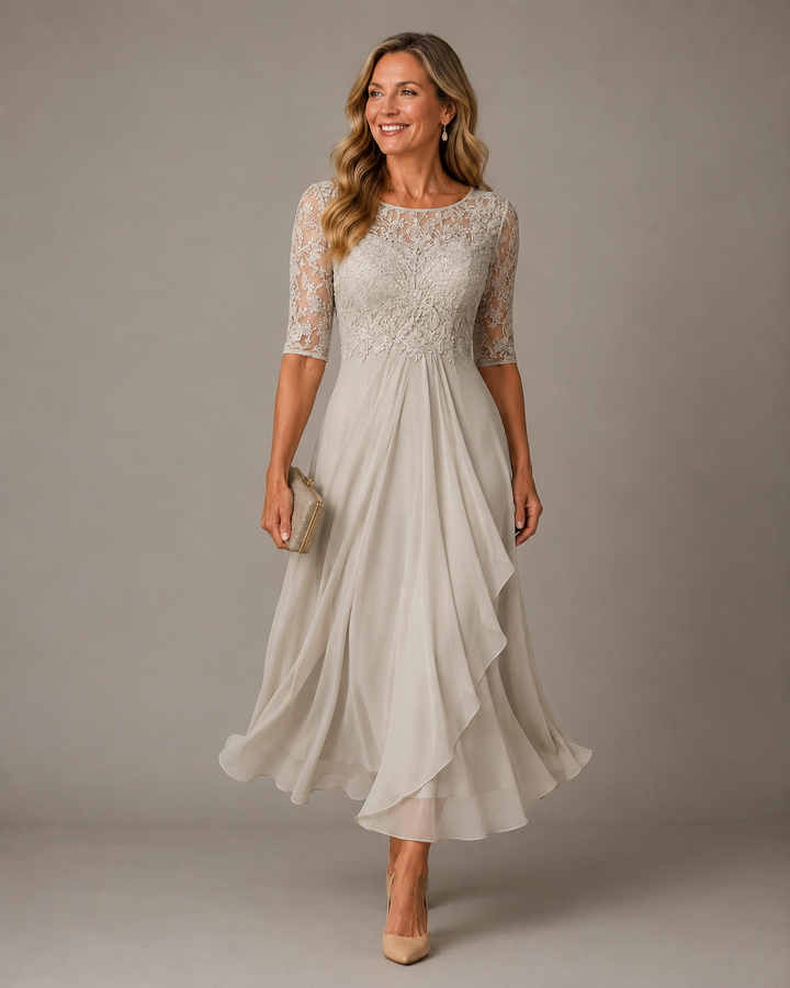Ivory dress with semi-sheer lace sleeves and soft draped hem