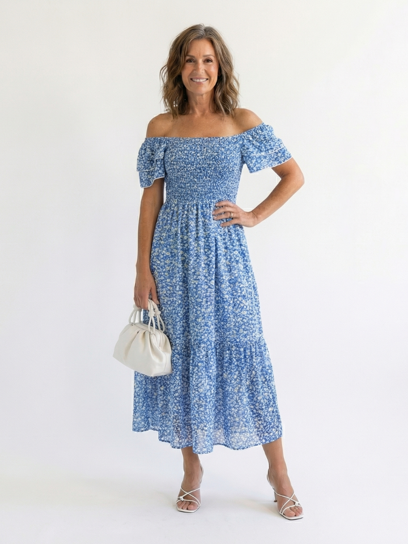 Blue floral dress worn off the shoulder with smocked bodice