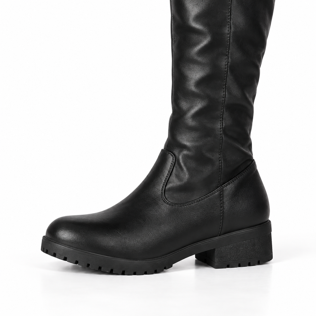 Side view of the black boot showing the low block heel
