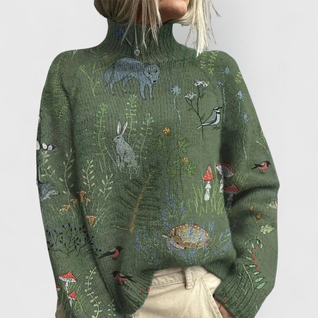 Sage green jumper with a woodland print of foxes, hares and birds