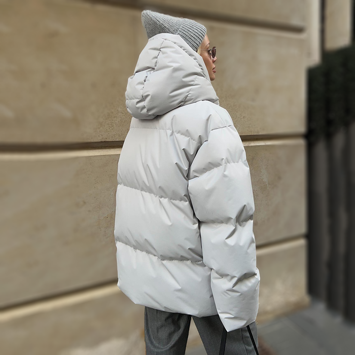 Back view of the light grey oversized puffer jacket with hood