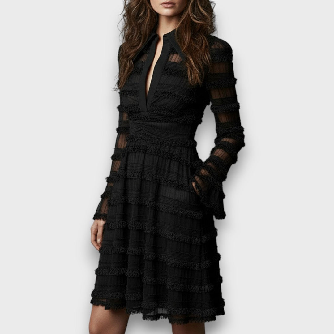 Black fringe midi dress seen from a three quarter angle