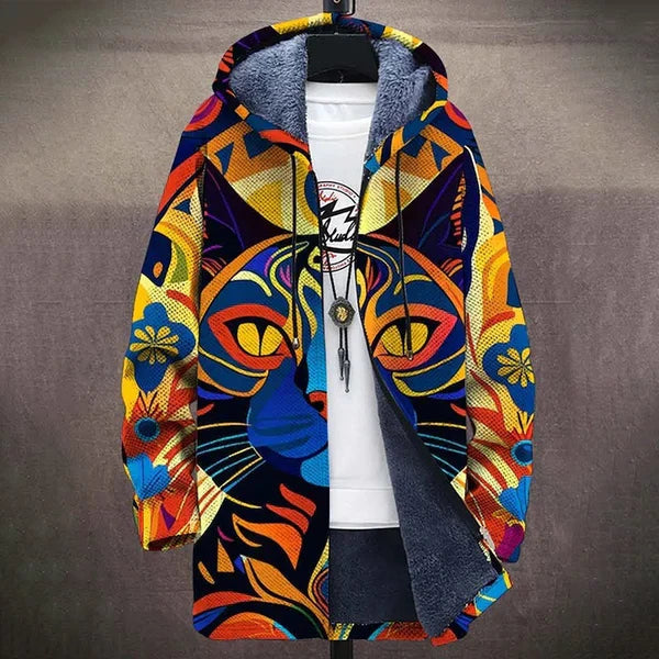 Women's print hoodie with a colourful folk art cat face and golden eyes, open over a tee