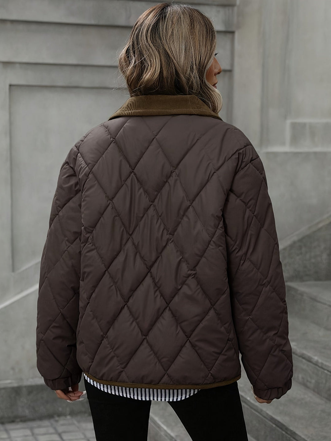 Back view of the dark brown quilted jacket with corduroy collar