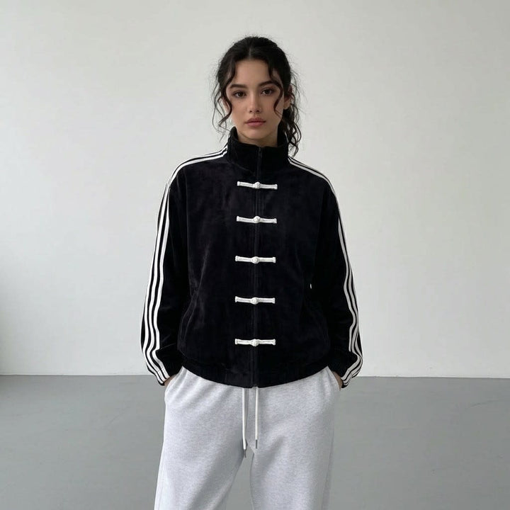 Black track jacket with white stripes and white toggle fastenings