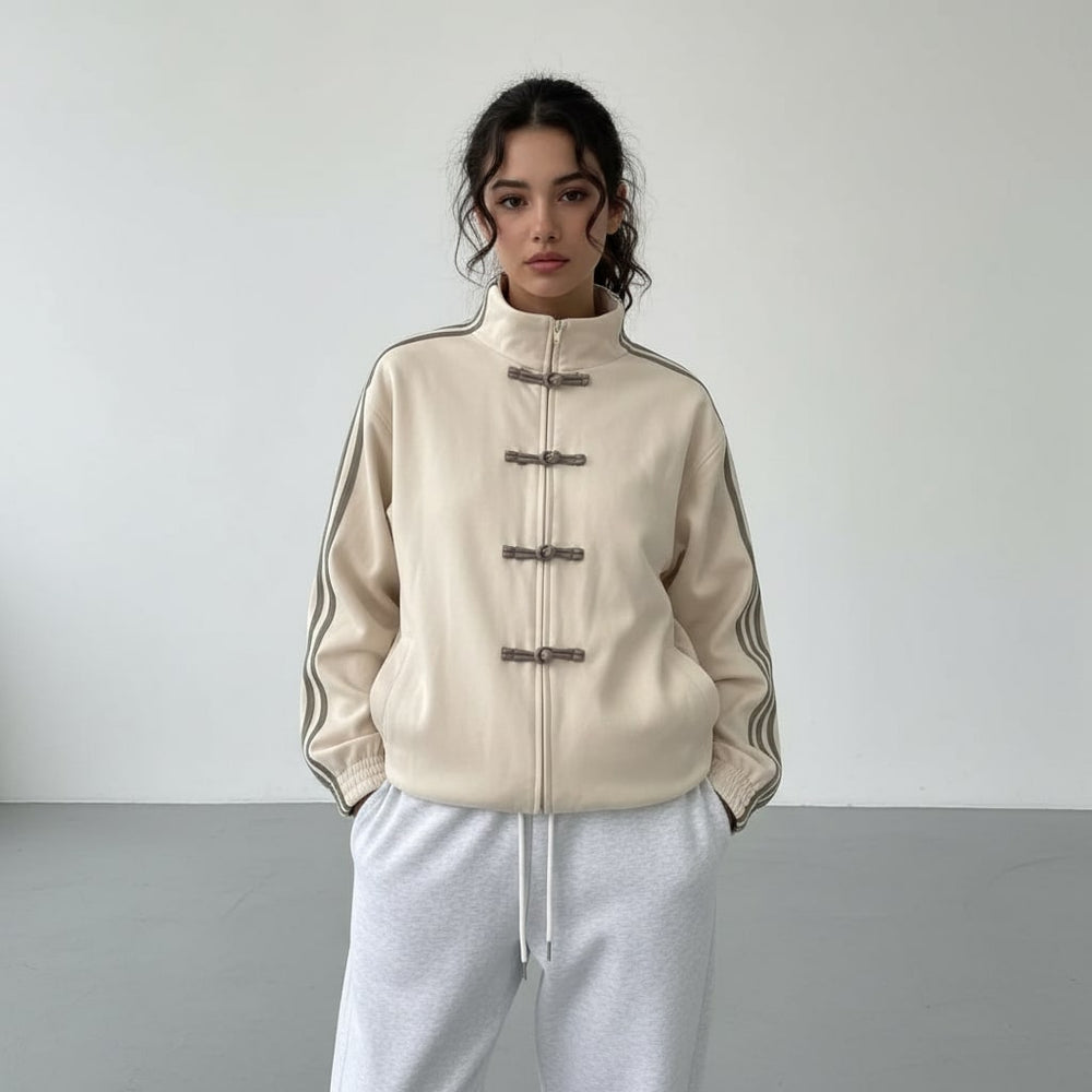 Cream track jacket with grey sleeve stripes and knotted toggles