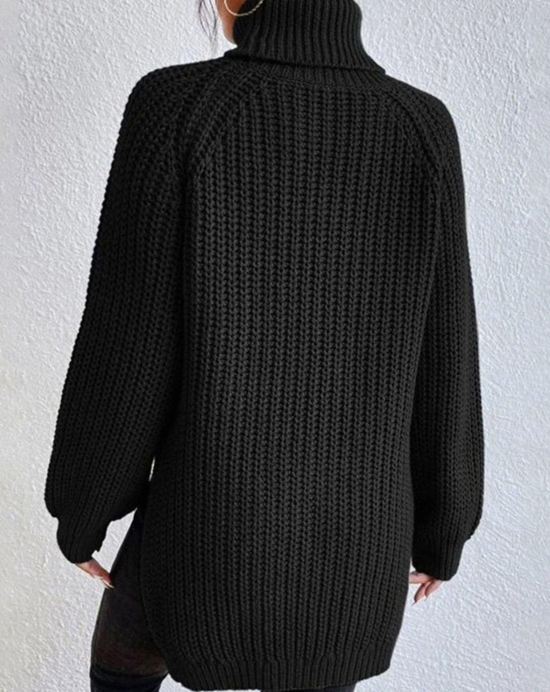 Back view of the black roll neck jumper