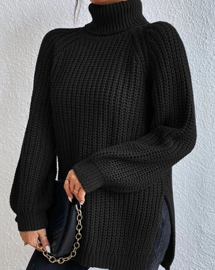 Black ribbed jumper worn with a quilted chain bag