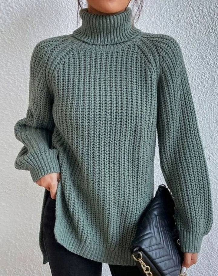 Sage green ribbed jumper worn with dark trousers