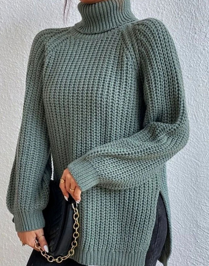 Sage green roll neck jumper showing the side split