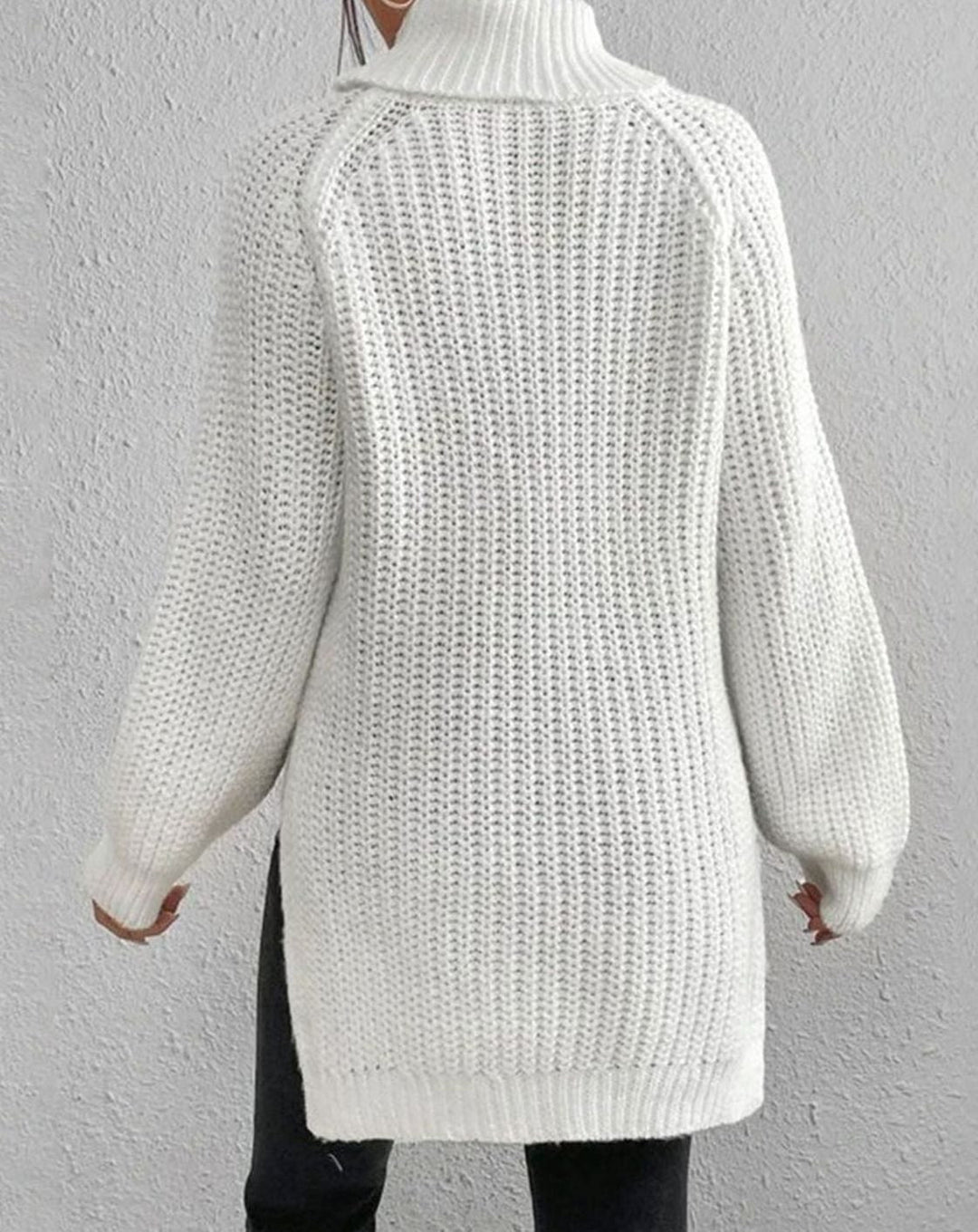 Back view of the white roll neck jumper with raglan seams