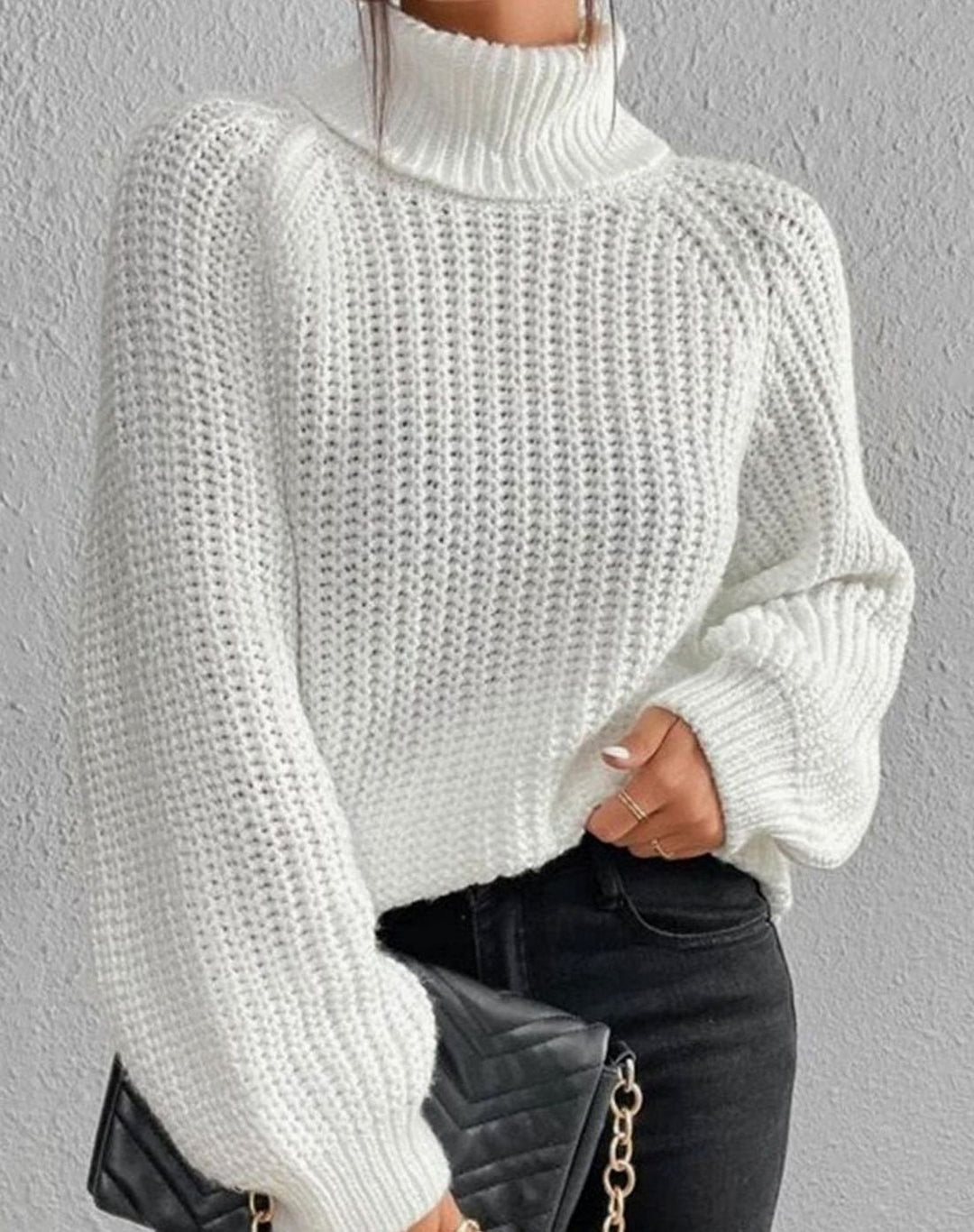 White chunky jumper with full balloon sleeves gathered at the cuff