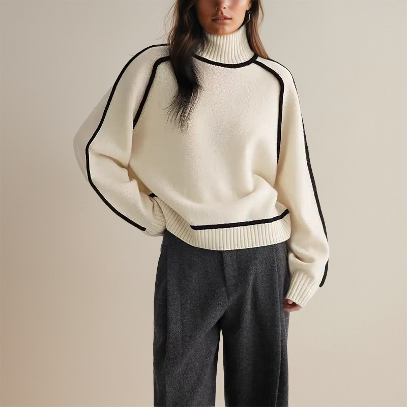Cream oversized jumper worn with grey tailored trousers