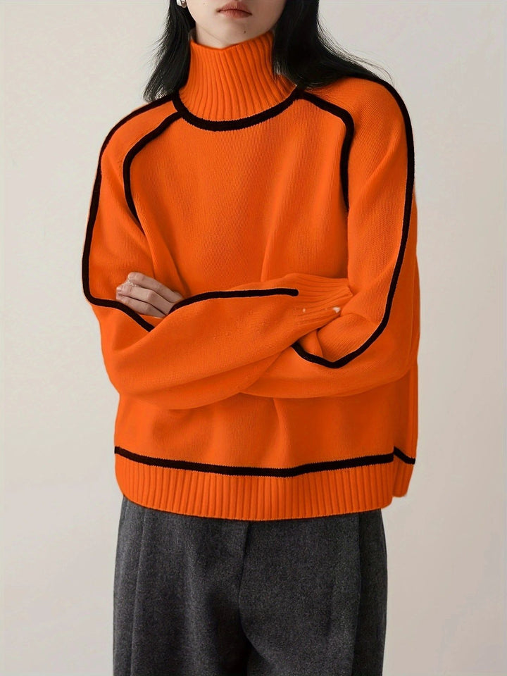 Orange oversized roll neck jumper with black piped seams and hem