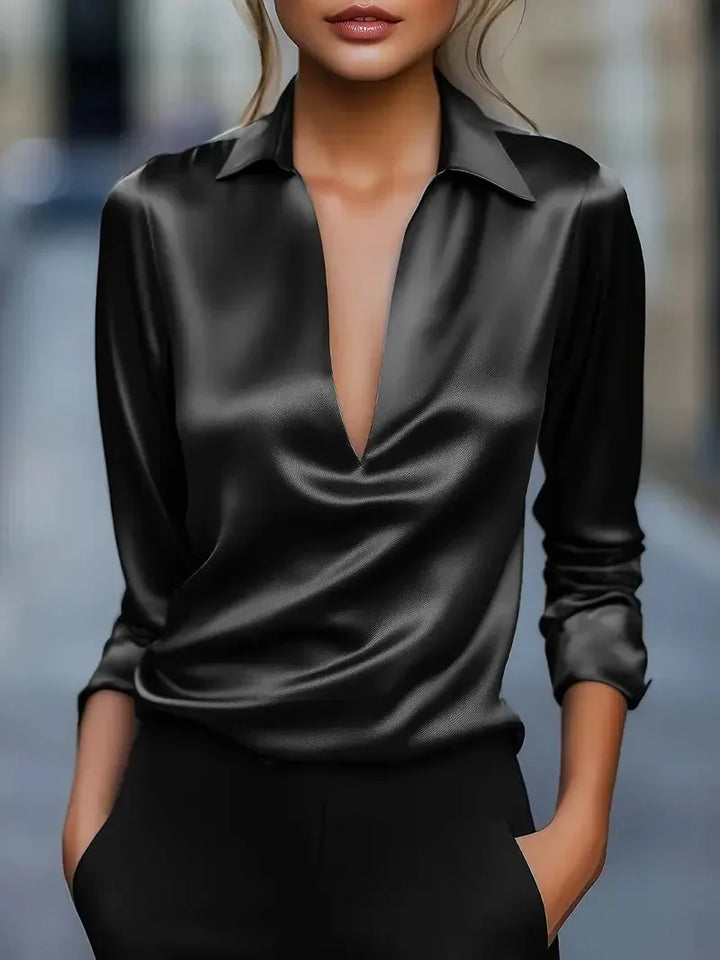 Black satin-look blouse with a deep V neck and long sleeves