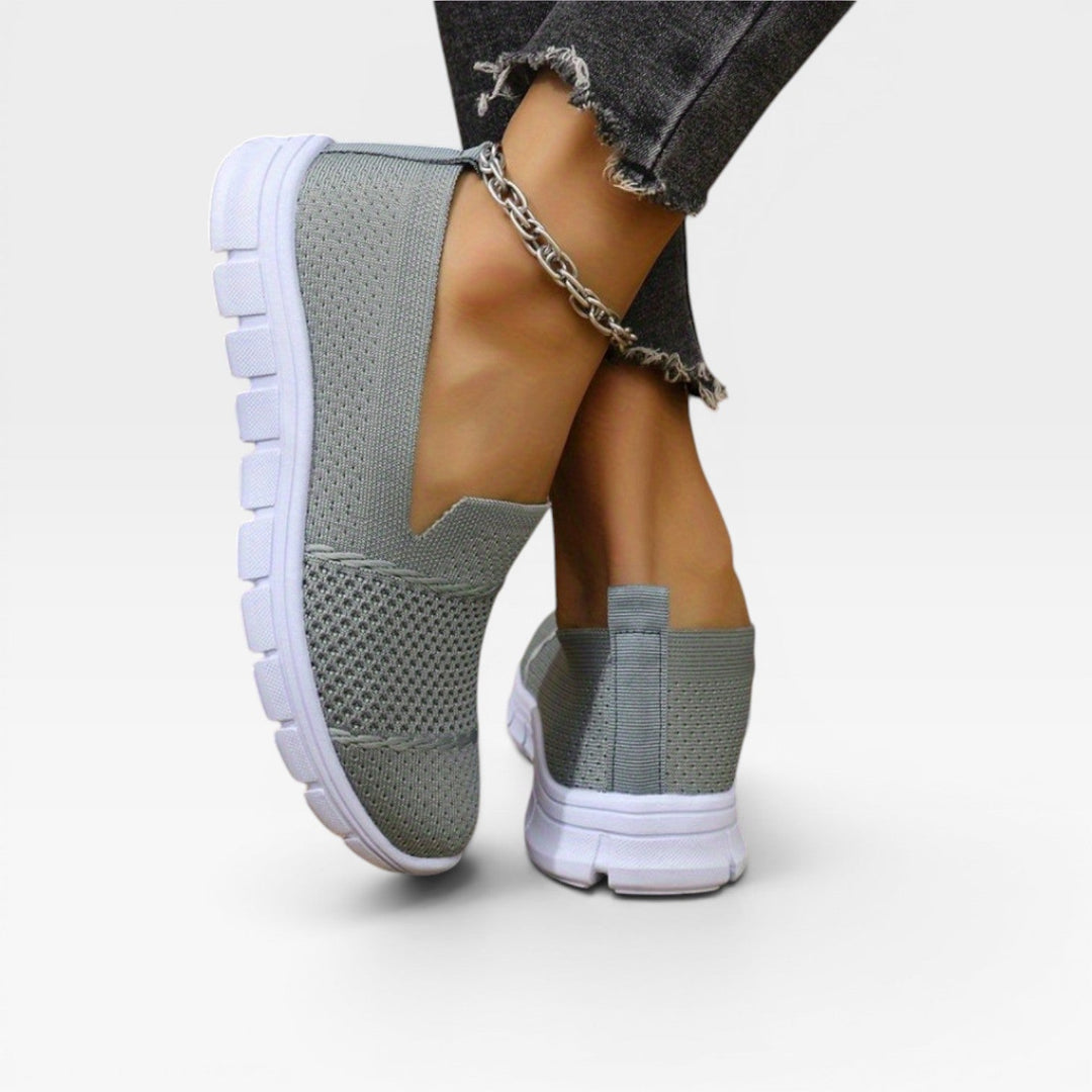 Back view of the grey trainers showing the heel pull loop