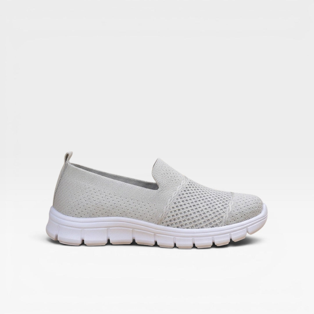 Light grey slip on knit trainers with a chunky white sole