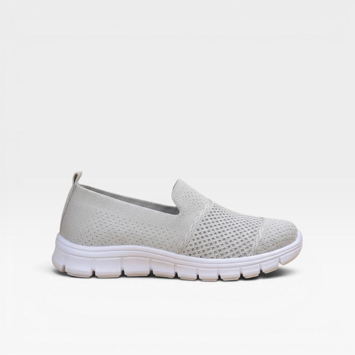Light grey slip on knit trainers with a chunky white sole