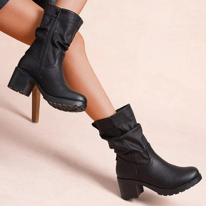 Black slouch boots, worn on foot, front view