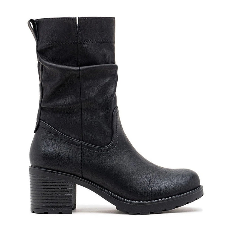 Black slouch boots, three quarter view on a plain background