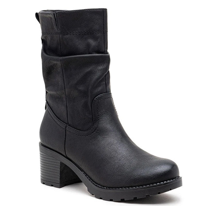 Black slouch boots, side view on a plain background