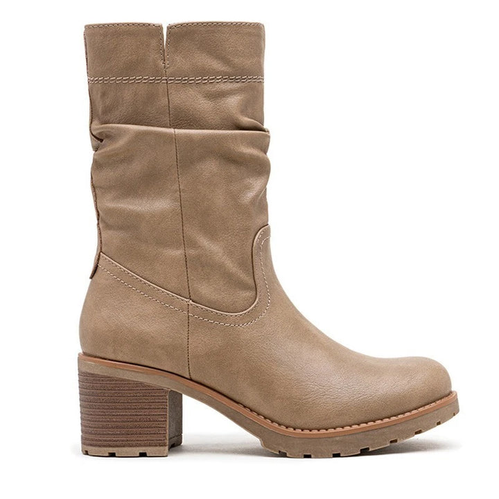 Taupe slouch boots, three quarter view on a plain background