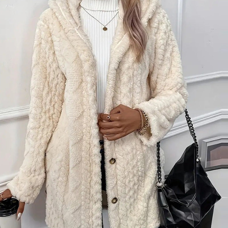 Cream teddy coat worn open, plush pile and dark buttons along the front