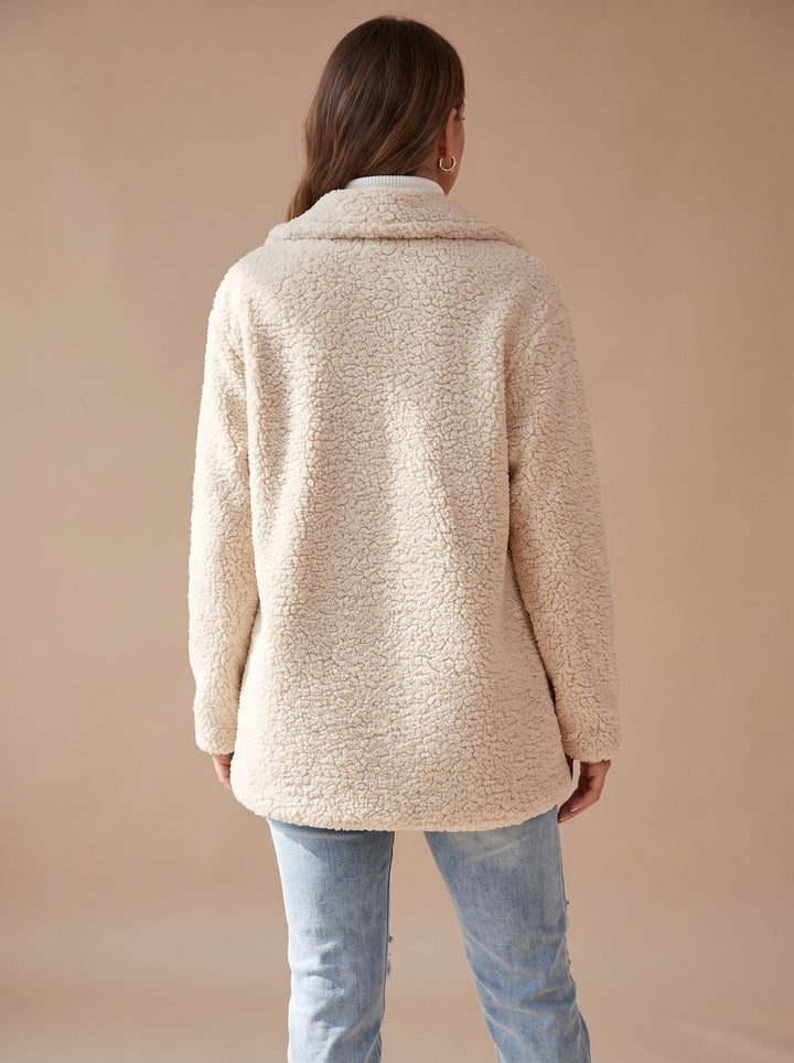 Back view of the cream teddy coat with its relaxed straight hem