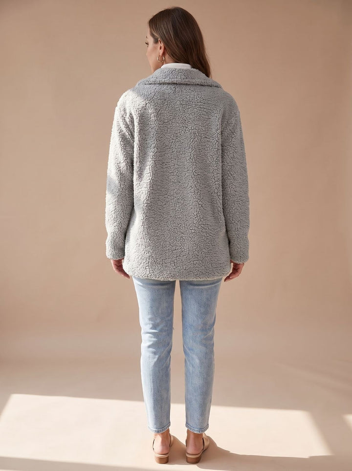 Back view of the light grey teddy coat showing the plush pile