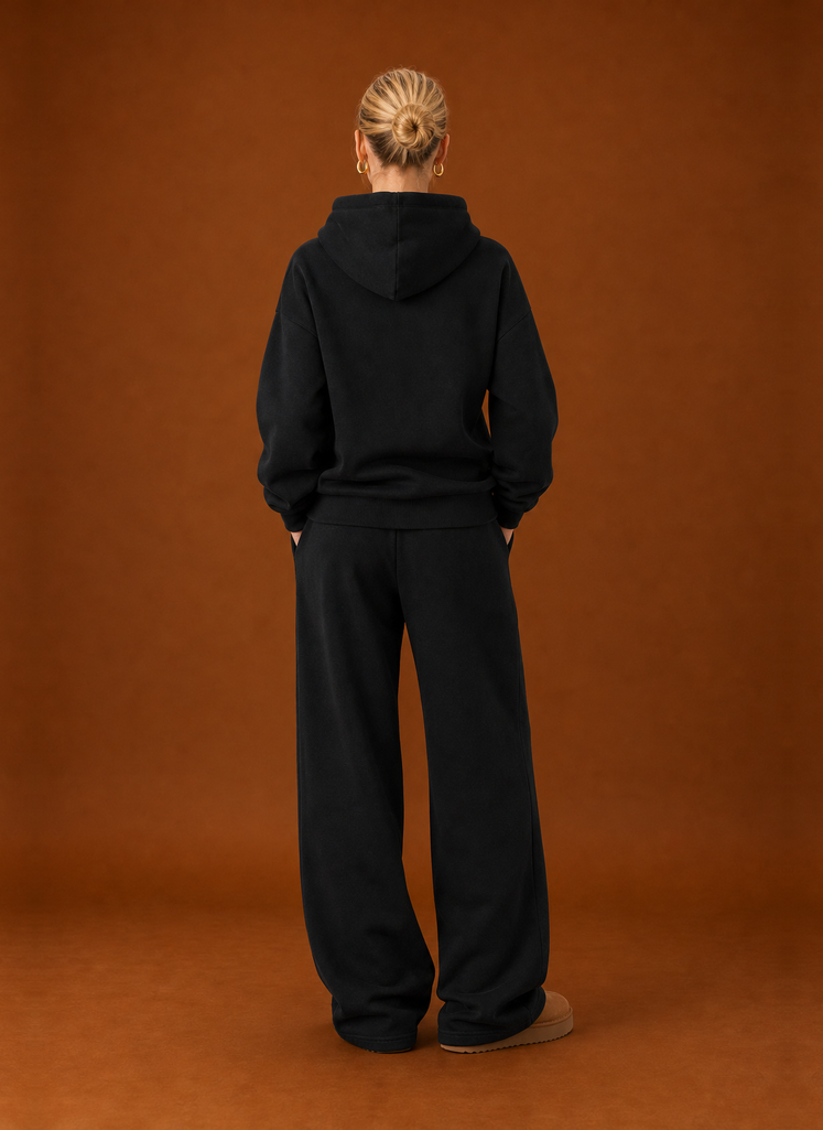 Back view of the black tracksuit set with the hood down