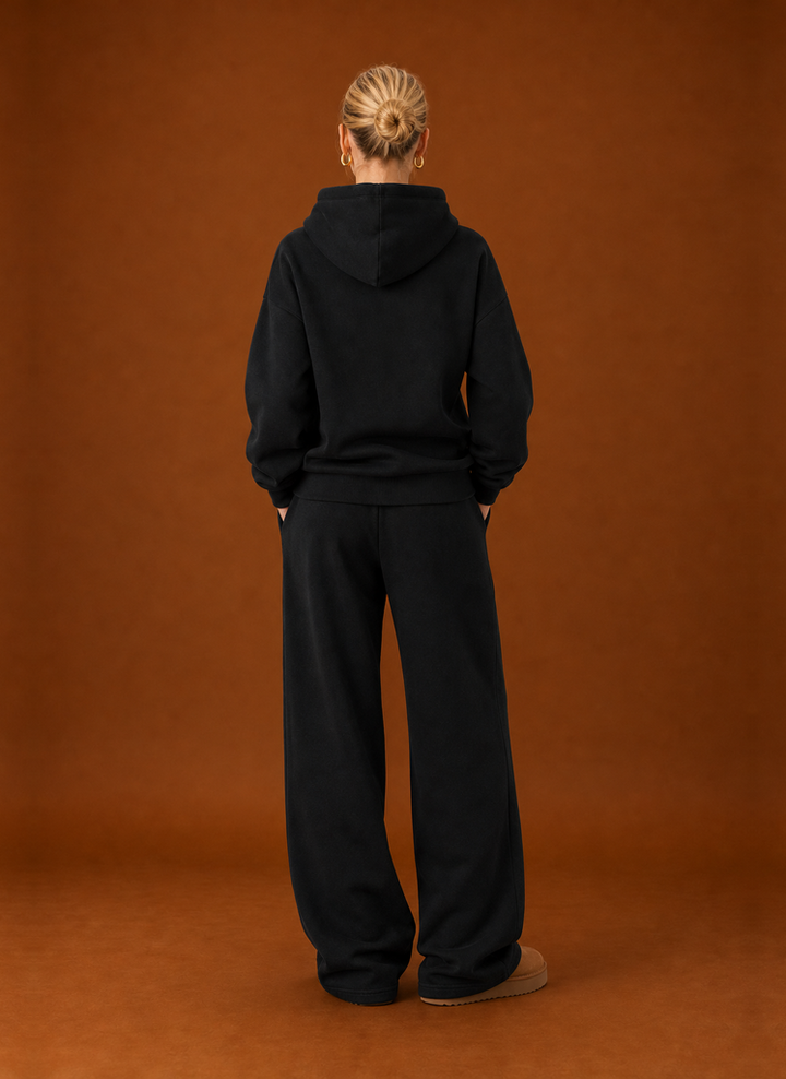 Back view of the black tracksuit set with the hood down