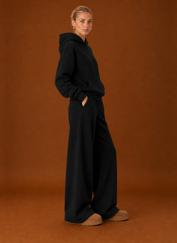 Side view of the black oversized hoodie and joggers