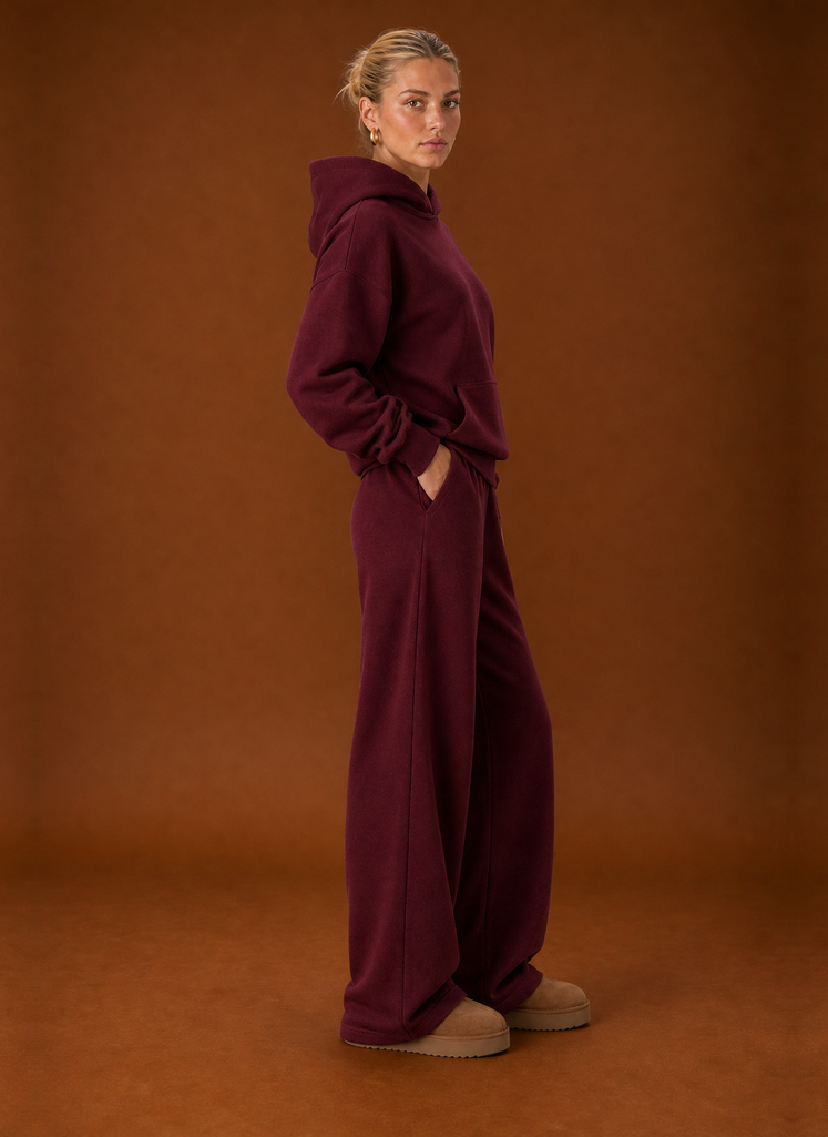 Side view of the burgundy oversized hoodie and joggers