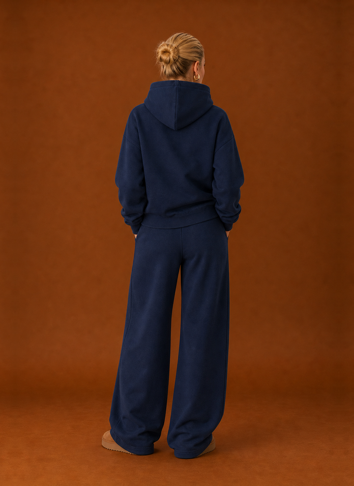 Back view of the navy tracksuit set with the hood down