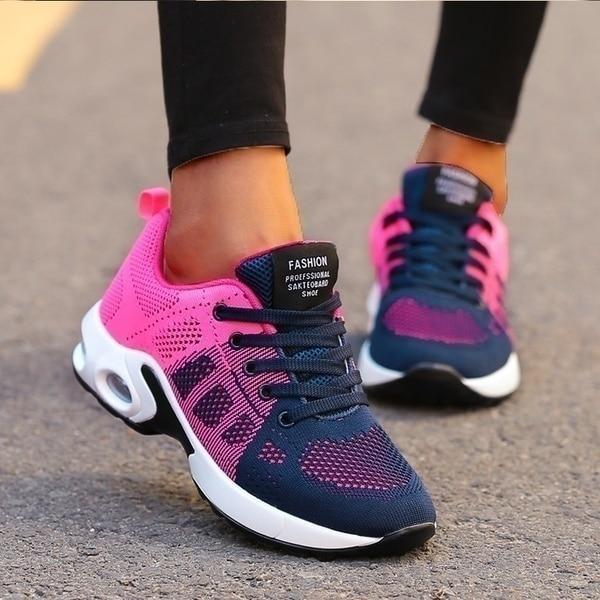Navy Pink trainers, worn on foot, front view