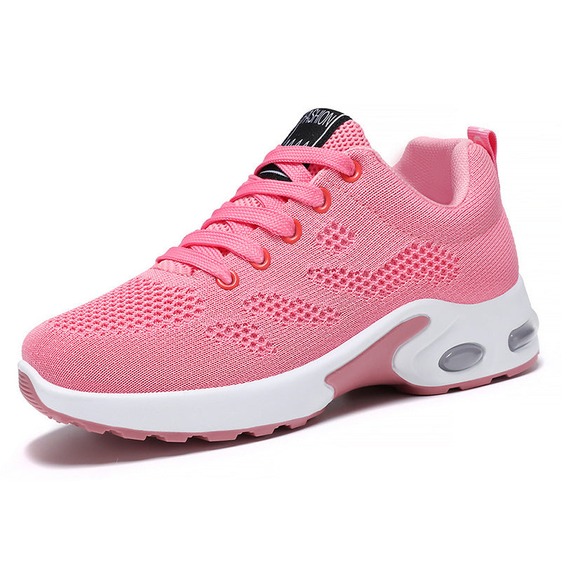 Pink trainers, side view on a plain background