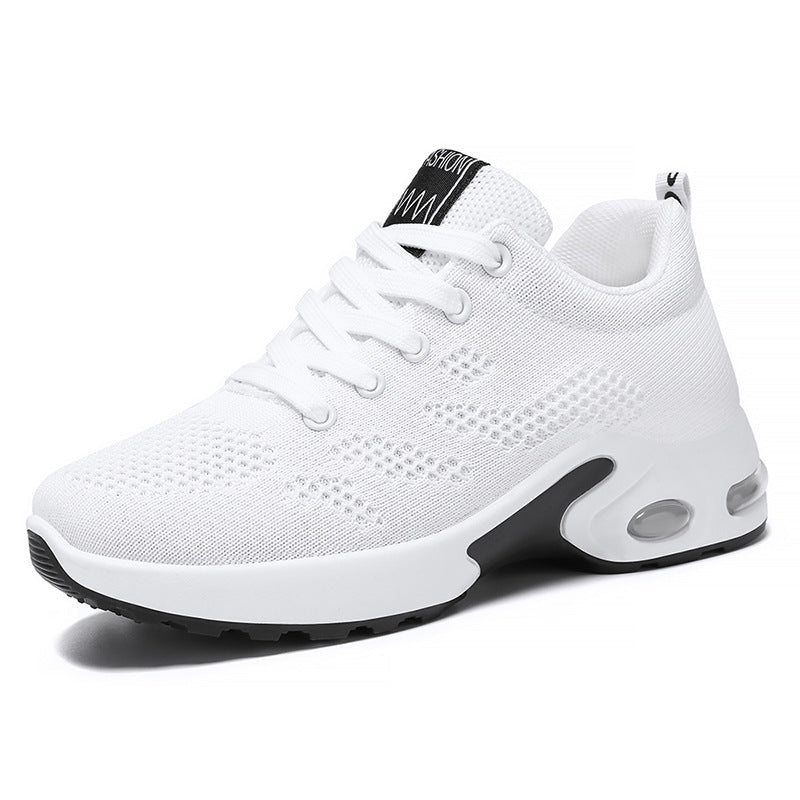 White trainers, side view on a plain background