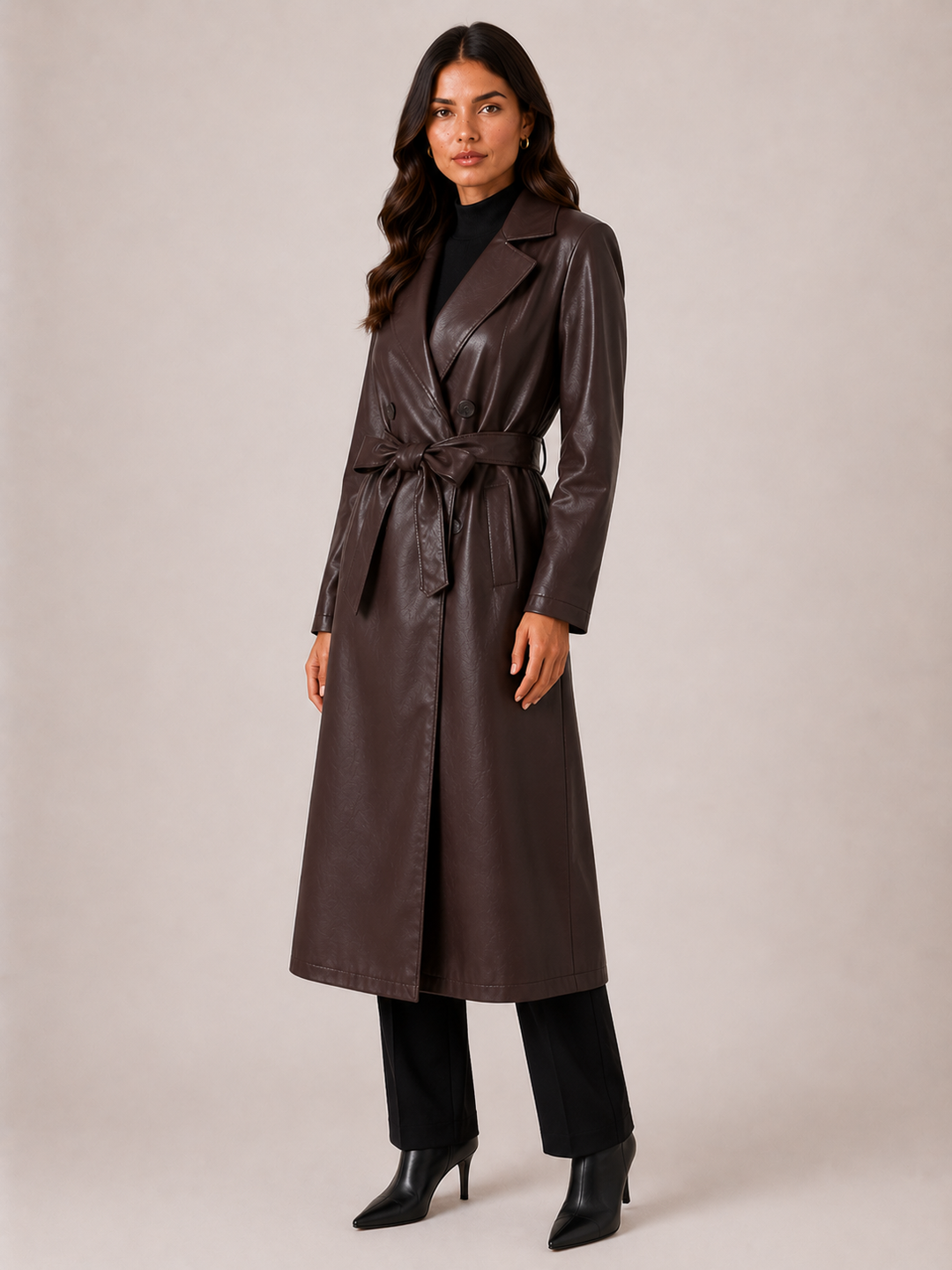Dark brown trench coat tied at the waist with the self belt