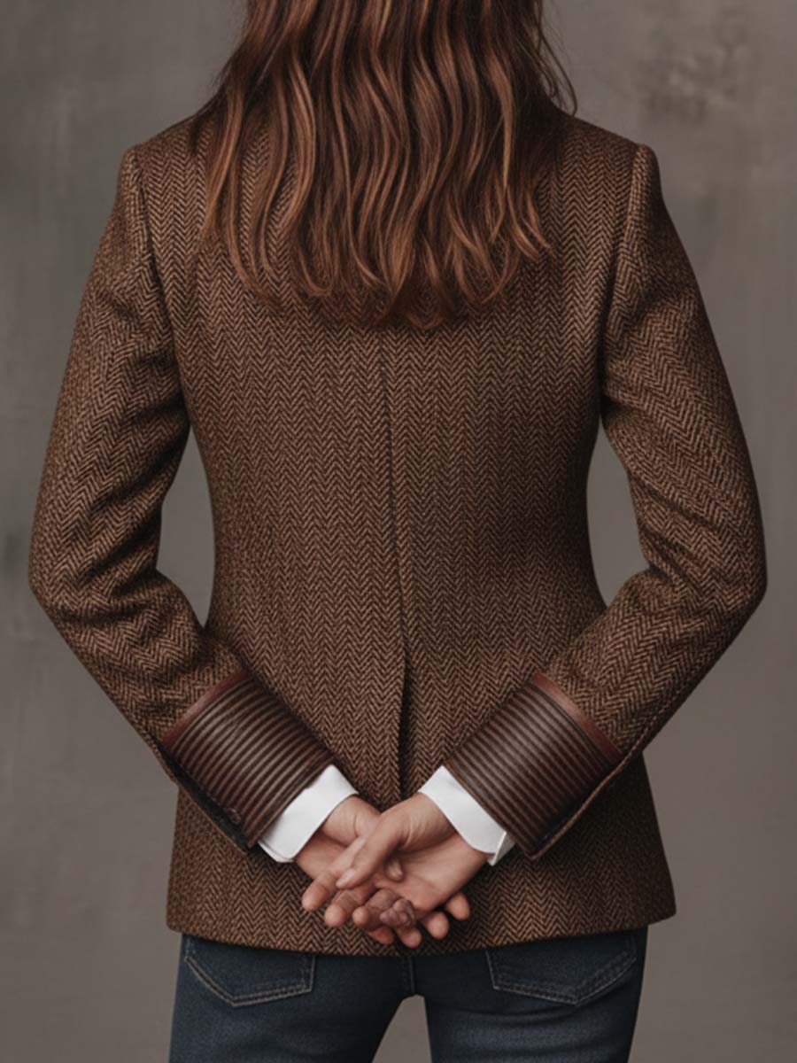 Back view with hands clasped, showing the striped cuffs