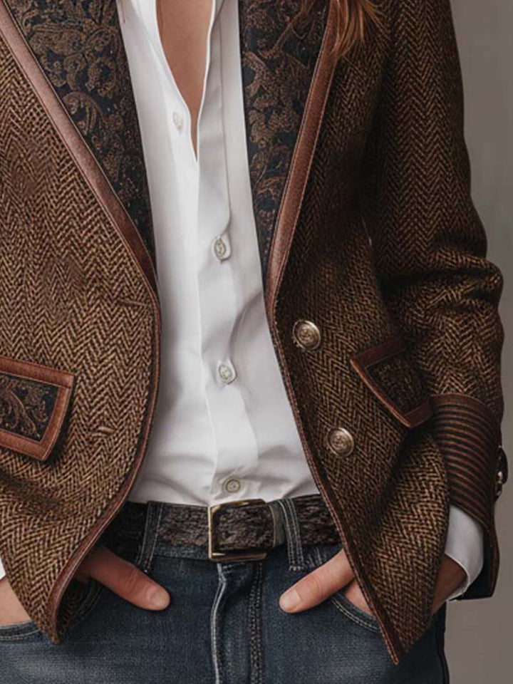Two-button front and piped hem of the herringbone blazer