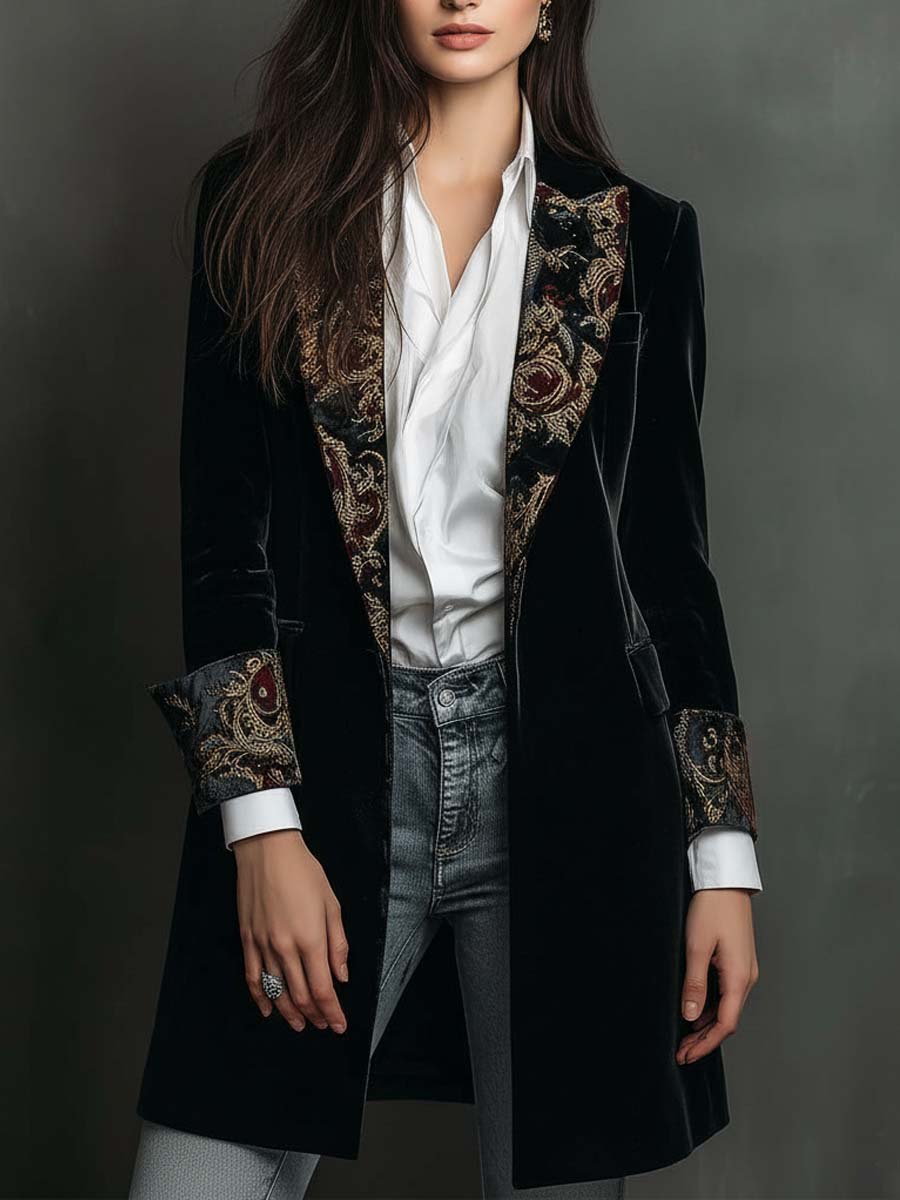 Black longline velvet jacket worn open over a white shirt