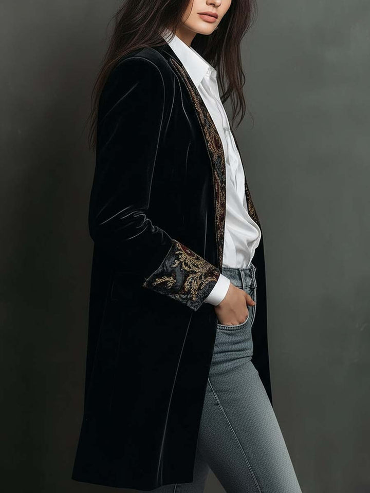 Side view of the black velvet jacket showing its long line
