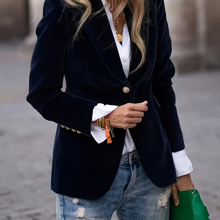 Black velvet-look blazer with notch lapels on a city street