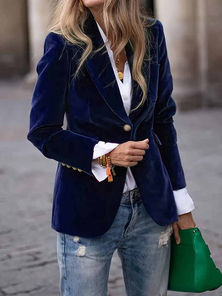 Royal blue blazer worn with a white shirt and gold-tone cuff buttons