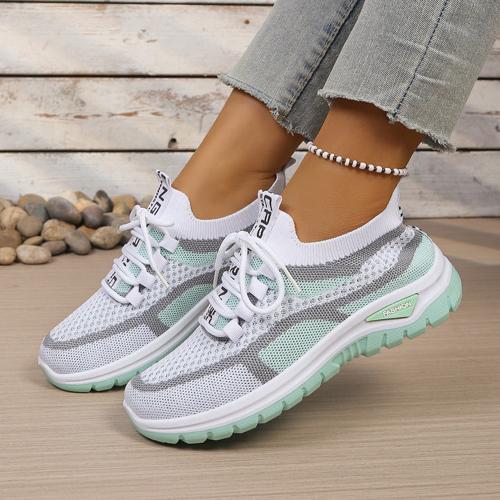 White Green walking trainers, worn on foot, front view