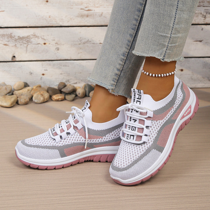 White Pink walking trainers, worn on foot, front view