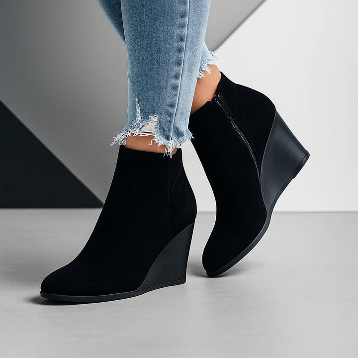 Black wedge ankle boots with a full length inner zip