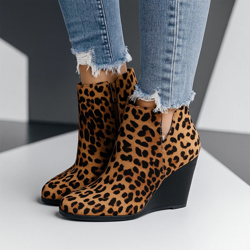 Leopard boots from the side with the V-cut opening on the shaft